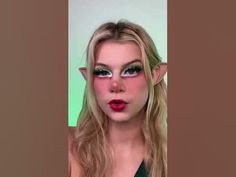 a woman with elf makeup and green eyes