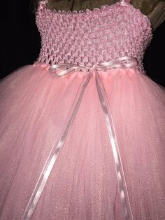 This adorably Pink Princess dress will be the hit of any celebration. Not like any costume that you would find in a store. It is super poofy! She will feel like the belle of the ball and twirl everywhere. The light pink crochet top is lined, making it soft and not see-through! The dress is made with many layers of light pink tulle that go all the way down to the floor. A small shiny pink bow is attached to the top to add a darling look. Light pink satin ribbon is used for the shoulder straps and Pink Tulle Ball Gown For Dress-up, Pink Tulle Ball Gown For Dress-up Events, Pink Tulle Skirt Ball Gown For Dress-up Events, Pink Tulle Pageant Dress For Wedding, Pink Tulle Skirt Pageant Dress For Wedding, Pink Princess Fairy Dress For Pageant, Party Princess Dress With Pink Bow, Pink Princess Dress With Tulle Skirt For Pageants, Pink Tulle Fairy Dress For Party