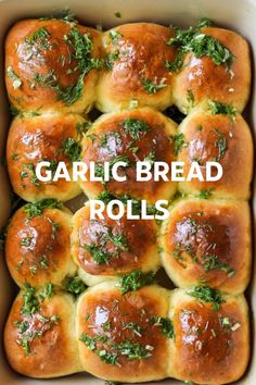 garlic bread rolls in a white casserole dish with the words garlic bread rolls