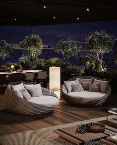 an outdoor living room with two circular couches