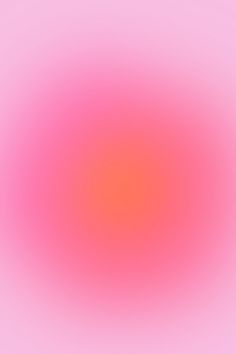 an orange and pink colored blurry background