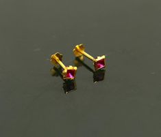 18 kt or 18 carat yellow gold handmade excellent single stone stud earring multi purpose stud we can use as nose pin also. Fabulous bridesmaid , customized personalized unises jewelry from india.Metal-18 kt yellow gold.Item type-stud earring/nose pin.Weight-0.200 grams.size-3.5 mm approxClosure- screw back.Makes excellent gifting for birthday,mother's day. valentines day, Christmas day, wedding anniversary. Cartilage Jewelry, Nose Pin, Baby Bracelet, Single Stone, Stone Studs, Nose Stud, Design Silver, Red Stone, Stud Earring