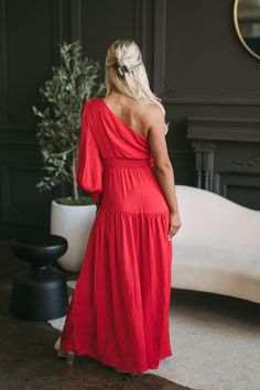 Redefine elegance in our One Shoulder Pleated Maxi Dress. Tailored with a one shoulder neckline and long sleeve, the cutout along the neck adds a subtle touch of flare. This sleek silhouette is embellished with pleated detailing, finished with a side zipper closure for an effortless fit! 100% polyester is Model is 5'5" with a 35" bust, 26" waist, and 37" hips and wearing a small, runs true to size Size recs: 0-2-S, 4-6-M, 8-10 L Red One Shoulder Asymmetrical Dress For Prom, Red One Shoulder Dress With Asymmetrical Neckline For Prom, Elegant Red Asymmetrical One Shoulder Dress, Elegant Red One-shoulder Evening Dress, Chic One Shoulder Maxi Dress For Bridesmaids, One-shoulder Dress For Prom, Solid Color One Shoulder Prom Dress, Solid One-shoulder Prom Dress, Solid Color One-shoulder Prom Dress