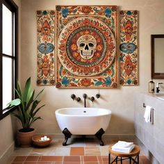 a bath room with a large painting on the wall and a white tub in front of it