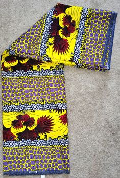 Let us introduce you to our colorful world of beautiful African print fabric! Their unique patterns and vibrant colors help you feel instantly happier, which is why we love using them to make Afrocentric clothing.  These versatile fabric can also be used to add touches of Africa interior design styles to your living space. They are fun to wearing can add warmth,  texture,  and cost feel to your wardrobe or home decor.  In fact,  they can be used to make absolutely pretty much anything!  African Ankara Fabric With Vibrant Patterned Print, Vibrant Patterned Ankara Fabric, Printed Yellow Ankara Fabric, Yellow Printed Ankara Fabric, Colorful Ankara Fabric With Multicolor Pattern, Multicolor Print Fabric, Multicolor Ankara Fabric With Colorful Pattern, Ankara Fabric With Vibrant Print, Multicolor Batik Print Fabric Patterns