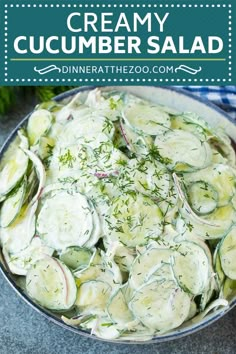 a bowl filled with cucumber salad on top of a table