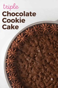 a chocolate cake in a pan with the words triple chocolate cookie cake on it's side