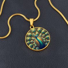 Admire the elegance of the Radiant Peacock Pendant Necklace, featuring a breathtaking stained glass style illustration of a peacock in full feather display. This intricate design showcases the peacock's vibrant plumage with stunning detail, capturing the essence of its regal beauty. Forged from premium surgical steel and available with a lavish 18k gold finish, this innovative jewelry boasts our exclusive design, handcrafted with care right here in the U.S.A by our dedicated team of skilled work Feather Display, Pendent Design, Peacock Jewelry, Peacock Necklace, Peacock Pendant, Circle Pendant Necklace, Luxury Necklace, Glass Style, Peacock Design