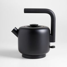 a black tea pot with a handle on it