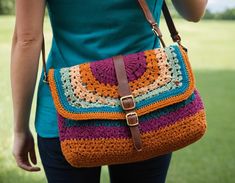 a woman carrying a crocheted purse on her shoulder