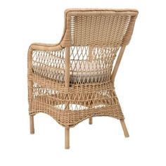 a wicker chair with a cushion on it's back and armrests