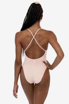 A classic ballet-inspired bodysuit with a low cut, pinched front neckline and a crossback design. This bodysuit has high leg openings for comfort under high waisted bottoms and a full coverage back. Made of a heavyweight cotton spandex with extra compression and as been garment dyed and enzyme washed providing unique colorways and rich, smooth texture. We recommend sizing up in this bodysuit if you are in-between sizes. Made in Los Angeles, Calif. Our experienced sewers earn up to $25 an hour an Seamless High-cut Leg High Stretch Bodysuit, High Cut Nylon Bodysuit With Built-in Bra, Beachwear Stretch T-back Bodysuit, Seamless Second-skin Beachwear Bodysuit, Pink Second-skin Seamless Bodysuit, Bodysuit Fashion, High Leg, Cotton Spandex, Low Cut