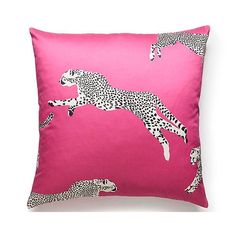 a pink pillow with cheetah and leopards on it