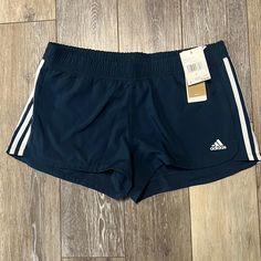 Ladies Blue Pacer 3s Woven Shorts By Adidas. Shorts Are Made Of Primegreen Recycled Materials And Designed For Ease Of Movement And Mobility. Shorts Have A 3 Inch Inseam, Internal Draw Cord And Bold Three Stripe Branding On The Sides And Adidas Logo On Front. New With Tags And Ships From A Pet Friendly Smoke-Free Home. Adidas Casual Shorts, Casual Adidas Shorts, Adidas Blue Workout Shorts, Casual Adidas Blue Shorts, Casual Blue Adidas Shorts, Adidas Blue Workout Bottoms, Adidas Stretch Shorts For Beach, Adidas Stretch Beach Shorts, Casual Adidas Beach Shorts