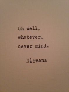 an old typewriter with the words, on well whatever never mind nirvana written in black ink