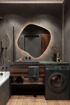 a washer and dryer in a bathroom with wood flooring on the walls