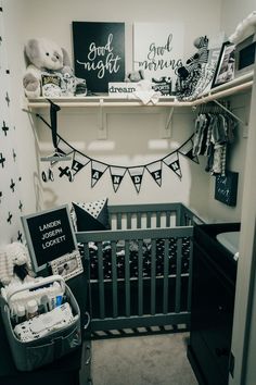 a baby's room is decorated in black and white