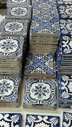 many blue and white tiles stacked on top of each other