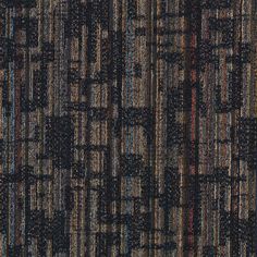 a black and brown rug with different colored lines