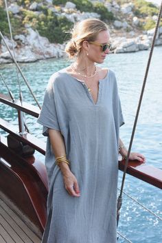 Style // The ultimate stormy blue kaftan is perfect for any occasion When comfort meets style, the Cala Kaftan features a billowy, shapeless silhouette and mid-length. With a v-neck silhouette, wide sleeves and two side slits, it promises to be your go-to look for that cozy, effortless look. The lightweight linen-cotton blend fabric is extra soft, to ensure you won't ever want to take it off Fabric Note // Made in Italy from a Linen & Cotton blend Sizing Advice // Available in one size, for an o Casual V-neck Kaftan For Daywear, Relaxed Fit V-neck Kaftan For Beach Season, Oversized V-neck Tunic For Beach Cover-up, Spring Kaftan With Relaxed Fit, Unlined, V-neck Tunic For Daywear With Relaxed Fit, Casual V-neck Kaftan With Relaxed Fit, Oversized Summer Tunic With V-neck, Summer Oversized V-neck Kaftan, Summer Oversized V-neck Tunic