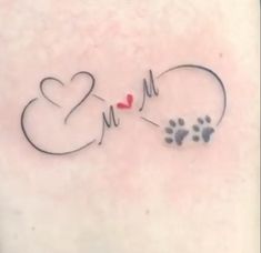 a dog's paw and heart tattoo on the chest