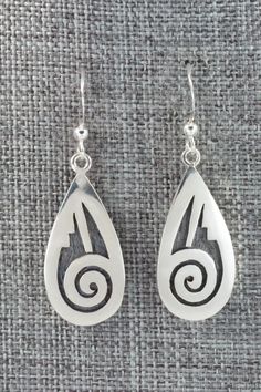 These sterling silver earrings are made by Hopi silversmith Timothy Mowa. The backs are signed and stamped sterling.Length: 1 5/8"Width: 1/2"Free shipping on all orders! We ship with USPS and always include tracking. All orders ship within a day of payment.Returns are accepted up to 30 days after you receive your order. Just send us a message. Our shop offers cash back or store credit. The item must be returned in new condition. Engraved Teardrop Sterling Silver Earrings, Symbolic Sterling Silver Pierced Earrings, Silver Engraved Teardrop Earrings, Silver Symbolic Engraved Earrings, Silver Engraved Symbolic Earrings, Symbolic Engraved Silver Earrings, Symbolic Hallmarked Sterling Silver Earrings, Native Pottery, Silver Casting