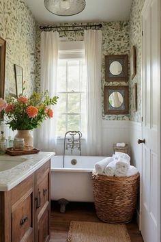 a white bath tub sitting next to a window in a bathroom under a light fixture