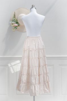 An elegant-yet-versatile skirt perfect for mixing-and-matching, the 100% cotton Antoinette skirt in cream features tiers accented with ruffles, a comfortable elastic waistline, and flowy silhouette made for twirling! . Details: S: Waist 26"-32", Length 35" M: Waist 28"-34", Length 35.5" L: Waist 30"-36", Length 36" Elastic Waistline Material: 100% Cotton Unlined Care: Hand Wash Cold / Hang Dry Imported Ships in 1 to 2 Business Days Free US Shipping on Orders over $100