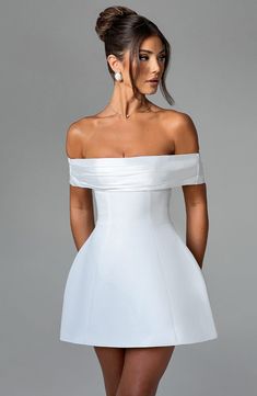 This oh-so-romantic, yet modern style is top of our wishlists. Make a statement in Delta, designed with a contrast bardot neckline that shows off your shoulders, and adorned with a dreamy bow detail to the back. In a playful mini length, the look is complete with a rounded, bubble shape skirt. 



Colour: Ivory.

Premium non-stretch crepe.

Fully lined.

Contrast bardot neckline.

Bow detail to back.

Rounded, bubble shape skirt.

Invisible zipper fastening.

Mini length.

 Size: XS, S, M, L, XL White Off Shoulder Party Dress With Straight Neckline, Elegant Off Shoulder Dress With Pleated Bodice, White Off Shoulder Dress With Straight Neckline For Party, Chic Strapless Off Shoulder Dress With Fitted Bodice, Elegant Strapless Off Shoulder Dress For Wedding, Chic Off-shoulder Strapless Dress With Fitted Bodice, Wedding Dress With Fitted Bodice And Boat Neck, White Off Shoulder Party Dress With Sweetheart Neckline, White Off-shoulder Party Dress With Sweetheart Neckline