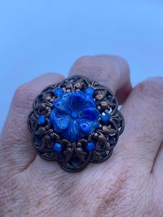 Vintage carved flower in lapis lazuli copper Ring Adjustable  Lovely vintage copper setting  Size 5-9 sample made in Paris  Ring is long covers from knuckle to knuckle. All rings are shipped in a nice gift box.   Check out our over a THOUSAND great reviews Engraving is $4 per letter and is not always perfect depending on the piece. It can take a few days if the jeweler is busy. This is payable to Paypal Judithsltd@gmail.com Adjustable Bohemian Blue Flower Ring, Handmade Blue Flower Ring, Paris Ring, Flower Stone, Copper Ring, Skull Bracelet, Pink Paisley, Copper Rings, Pashmina Scarf