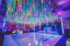 a large room filled with lots of colorful lights