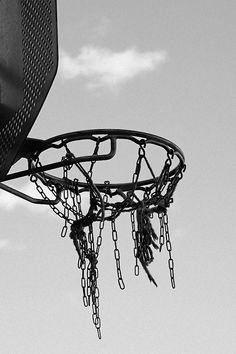 a basketball hoop with chains hanging from it