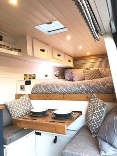 a bed sitting inside of a bedroom on top of a wooden floor