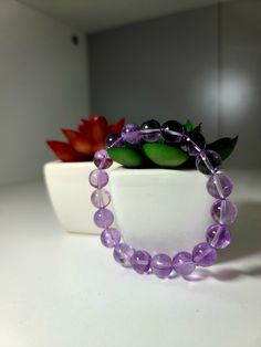 This 9mm transparent deep lavender amethyst bracelet is absolutely breathtaking!  The meaning of Amethyst is attached to serenity, understanding, trust, and grace.   This lovely bracelet is made from 9mm grade AAA genuine natural deep lavender amethyst beads! **TO MEASURE YOUR WRIST: You will need a flexible measuring tape OR something flexible to wrap around your wrist and a ruler (See example in pictures). Wrap the measuring tape around your wrist, making sure to wrap it all the way around your wrist. We suggest measuring your wrist in the area you ultimately wish for your bracelet to sit.** #lavender #transparent #deeplavender #amethyst #beadedbracelet Amethyst Beaded Bracelet, Amethyst Bracelet Beads, Lavender Amethyst, Bead Charms Diy, Diy Bracelet Designs, Star Bracelet, Amethyst Bracelet, Amethyst Beads, Diy Bracelet