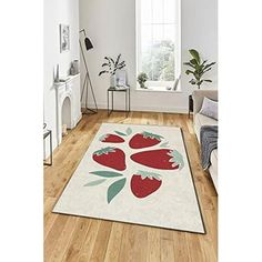 a white rug with red flowers on it