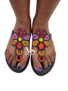 100% handmade using leather and fine beads. Masai beaded sandals are made using the pure original leather and quality African beads.They are inspired by the Masai community They are perfect for any occasion. True to size. We ship worldwide. Feel free to send me a convo for any clarifications Beach Festival Toe Post Sandals, Toe Post Sandals For Beach Festivals, Beach Festivals Toe Post Sandals, Handmade Multicolor Barefoot Sandals For Vacation, Open Toe Barefoot Sandals For Festivals And Vacation, Traditional Handmade Sandals For Party, Handmade T-strap Sandals With Toe Post For Vacation, Bohemian Beaded T-strap Sandals For Vacation, Handmade Single Toe Strap Sandals For Festivals