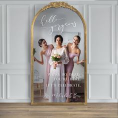 a wedding photo with the bride and her three bridesmaids in front of a mirror