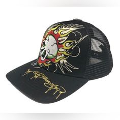 Ed Hardy Fire Skull Snapback Trucker Hat Color: Black Style# Ehh0001-36 Printed And Embroidered Logos One Size Fits Most Adults Front Panel: 100% Cotton Back Panel 100% Polyester Sunshade Back 76% Cotton, 17% Rayon, 7% Polyester Made In China Black Biker Cap, Black Trucker Hat With Graphic Print, Trendy Black Baseball Cap With Graphic Print, Black Graphic Print Trucker Hat, Black Casual Hat For Festivals, Black Casual Festival Hat, Summer Graphic Print Baseball Cap For Streetwear, Adjustable Black Baseball Cap With Graphic Print, Black Snapback Hat For Summer Festival