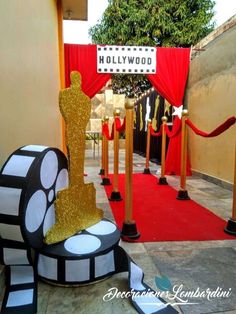 an oscar statue is on display in front of the hollywood walk of fame ceremony entrance