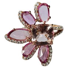 A very gorgeous and beautiful, Morganite & Pink Sapphires Cocktail Ring set in 18K Rose Gold & natural Diamonds. The weight of the Morganite is 3.25 carats. The weight of the Pink Sapphires is 3.72 carats. The Pink Sapphires are of Ceylon (Sri Lankan) origin. The Diamonds weight is 1.03 carats. Net 18K Rose Gold weight is 6.76 grams. The Gross weight of the Ring is 8.36 grams. The dimensions of the Ring are 3.00cm x 2.50cm x 1.00cm (L x W x D). The Ring is made in US Size 6.5 and can be changed Contemporary Rings, October Sale, Sapphire Cocktail Ring, Pink Sapphire Ring, Floral Ring, Diamond Cocktail Rings, Christmas Collection, Rose Gold Diamonds, Sapphire Diamond