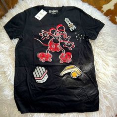 Exclusive, Disney X Coach Mickey T-Shirt Brand New With Tags I Also Have The Bag With Coach Mickey Stickers Size Is Extra Small, But Can Definitely Fit A Small Disney Cotton Tops With Embroidered Graphics, Casual Embroidered Graphics T-shirt For Fans, Casual T-shirt With Embroidered Graphics For Fans, Black Disney Fan Merchandise T-shirt, Black Graphic Print Tops For Disney Fan Events, Mickey Mouse Crew Neck Top For Streetwear, Trendy Mickey Mouse Short Sleeve T-shirt, Black Mickey Mouse Tops For Disney Events, Black Disney Graphic Tee