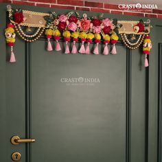 a door decorated with flowers and tassels