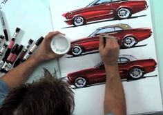 a man is painting a red car on a white board with markers and crayons