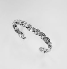 925 Sterling Silver Wire Braided Cuff bracelet Handcrafted 3 Strand wire by silver smith. Good quality, charming design. good for birthday, anniversary, Christmas gift made of : 925 Genuine sterling silver (Not silver plate, Nor silver coated) Size : 7, 71/2, 8 inch wrist. Weight : 15.3 g Handmade Silver Braided Sterling Silver Bracelet, Sterling Silver Braided Bangle Bracelet As Gift, Sterling Silver Cuff Bracelet With Clasp As Gift, Silver Sterling Silver Braided Bangle Bracelet, Sterling Silver Braided Bracelet With Silver Clasp Gift, White Gold Sterling Silver Braided Bracelet For Gifts, White Gold Sterling Silver Braided Bracelet As Gift, Sterling Silver Braided Bangle Bracelet, Braid Cuffs