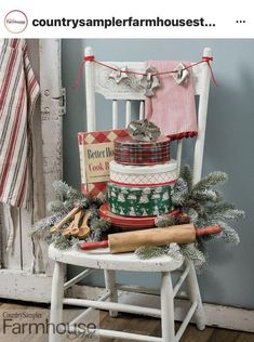 an old chair is decorated with christmas stockings and other holiday items for the country farmhouse house