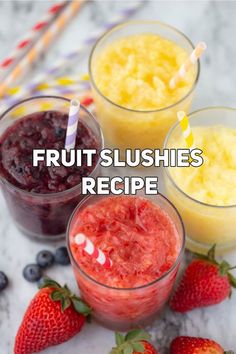 fruit slushies in small glasses with strawberries and blueberries next to them