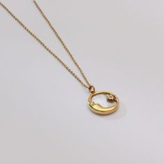 Capture the serene beauty of the night sky with our elegant gold crescent moon pendant, featuring a stunning shell inlay that shimmers with ethereal colors. This minimalist necklace is a subtle yet striking accessory, perfect for those who appreciate the delicate balance of modern style and timeless symbolism.   Enhance your jewelry collection with this beautifully crafted crescent moon necklace, a symbol of mystery and elegance. Care Instructions   Avoid exposure to harsh chemicals and store th Moon Shaped Celestial Necklace With Sun And Moon Design, Celestial Moon-shaped Necklace With Sun And Moon Design, Celestial Moon Necklace With Sun And Moon Design, Silver Sun And Moon Design Gold-plated Necklace, Elegant Sun And Moon Design Necklace, Elegant Gold-plated Sun And Moon Necklace, Elegant Sun And Moon Design Round Pendant Jewelry, Elegant Sun And Moon Design Half Moon Jewelry, Gold Plated Moon Jewelry With Sun And Moon Design