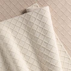 the textured fabric is white and beige