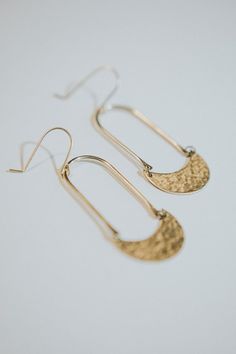 Hammered Crescent Moon Earrings/ Hammered Earrings/ Hammered Half Moon Earrings/ Hammered Brass/ Half Moon Earrings/ Hammered Moon EarringsThese earrings are simple yet make a statement! They are hand formed, shaped and hammered so please be mindful that each piece will vary slightly. They are made of raw brass with a lead and nickel free brass ear wire, and are extremely lightweight! They are texturized using a type of hammer that puts tiny dents in the metal. From ear hook to bottom of piece t Crescent Hammered Earrings, Elegant Hammered Crescent Earrings, Elegant Half Moon Metal Earrings, Elegant Half Moon Earrings For Everyday, Elegant Half Moon Everyday Earrings, Elegant Everyday Half Moon Earrings, Moon Shaped Brass Earrings With Ear Wire, Everyday Crescent Earrings With Ear Wire, Gold Half Moon Pierced Earrings