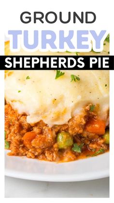 a white plate topped with shepherds pie covered in gravy